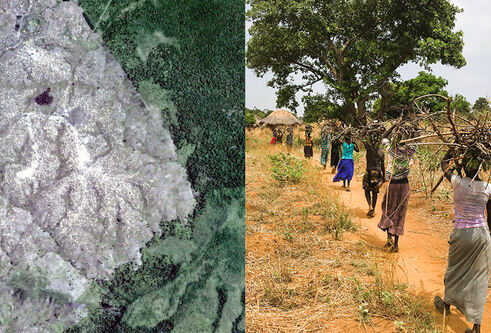 Aerial view of a sandy terrain with some vegetation on the left; women walking with sticks on their heads on the right.