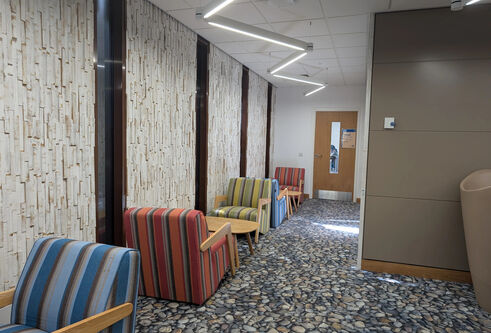 A row of occassional chairs set up in a corridor