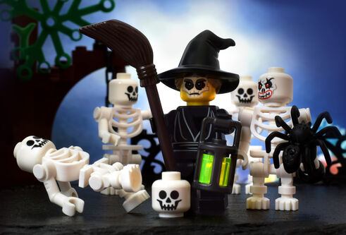 Photo showing a Lego scene comprised of a group of skeletons and a spooky looking witch