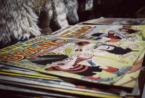 A selection of comics viewed at an angle