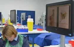 A photograph of a person in uniform working in the Thiel Cadaver Facility