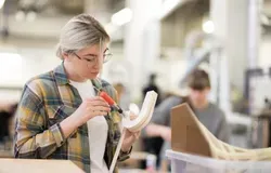 a student working on a project in the workshop