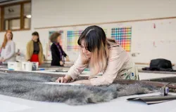 Student working on textiles