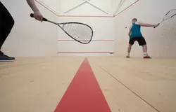 Two people play squash on the courts at Institute of Sport and Exercise