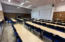 1 Perth Road Accountancy Lecture Theatre with rows of tables and two white screens