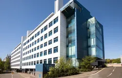 Sir James Black Centre a six story white and blue building on the Dundee city campus