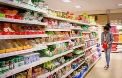 Student in supermarket aisle