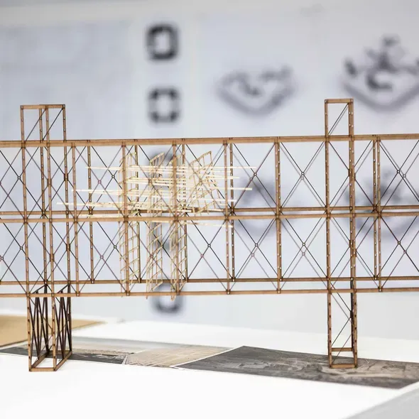 A wooden model of a building as part of the Degree Show 2025 exhibition