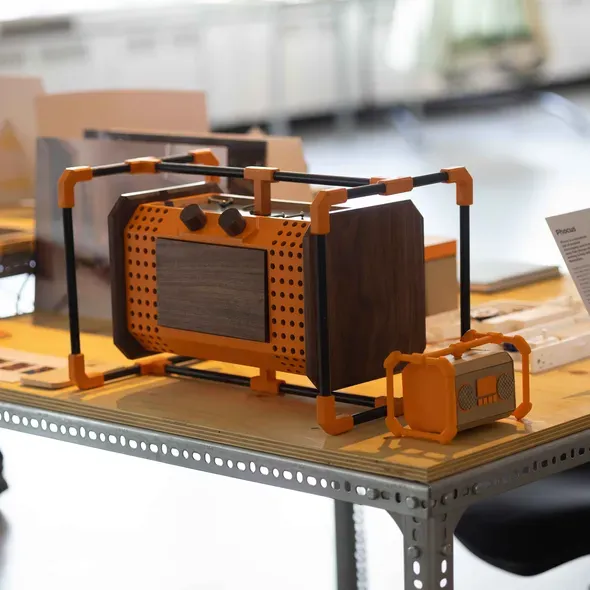 A radio with parts to open and close to put your mobile phone away as part of the Degree Show 2025 exhibition