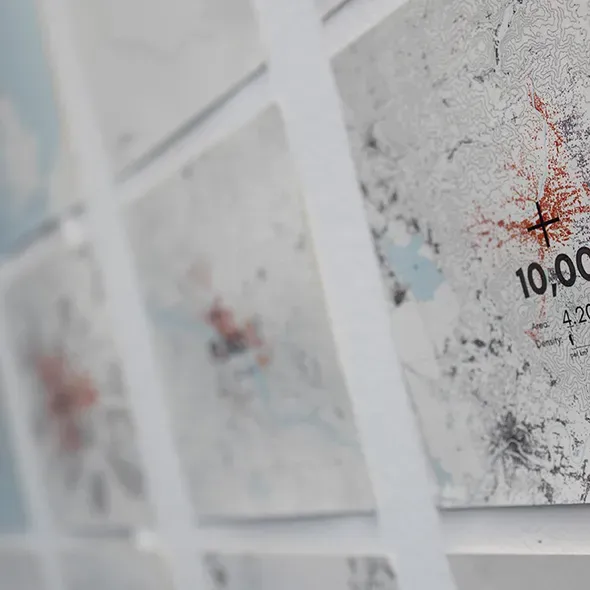 Maps hanging on a wall as part of the gradudate showcase exhibition for Urban Planning