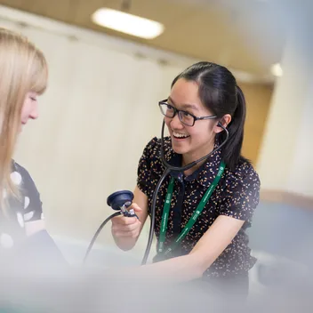 Student taking blood pressure
