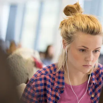 Student studying in an IT suite
