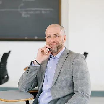 Portrait photo of Patrick Akos