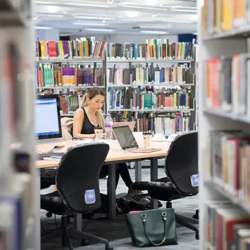 a student studying in a library