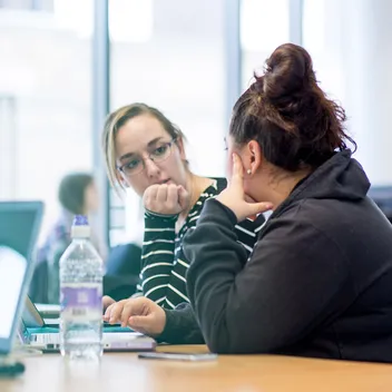 Two students in library