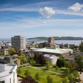 The campus green from the top of Belmont Tower. Looking over the city to the river Tay.