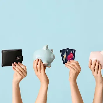 Hands in the air holding wallets and piggie banks