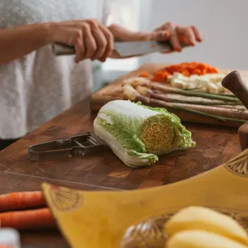 person chopping vegetables