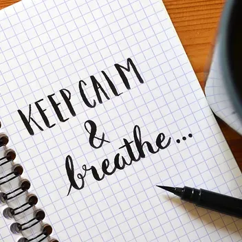 Notepad with the words 'Keep calm & breathe'