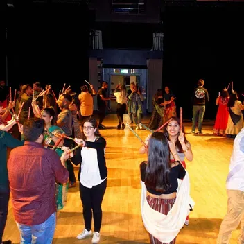 students in indian clothes celebrating a festival