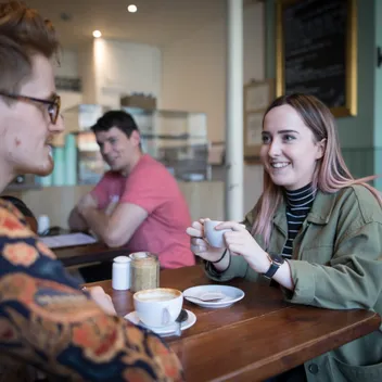 Students sitting in a cafe together