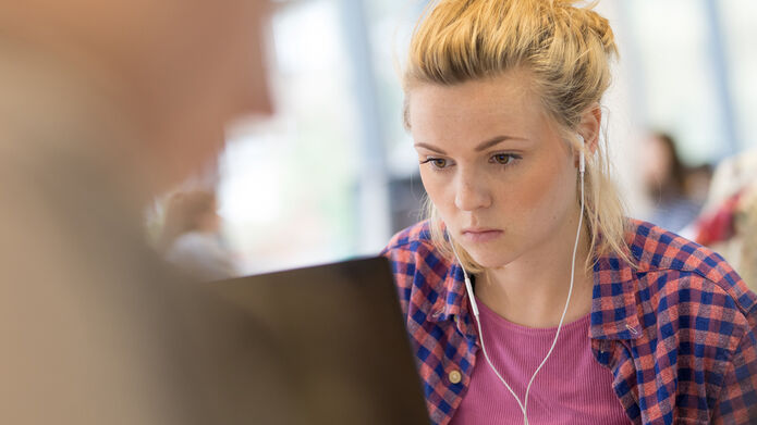 A student working on a laptop