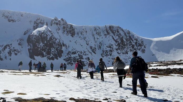 Students trekking across the snow