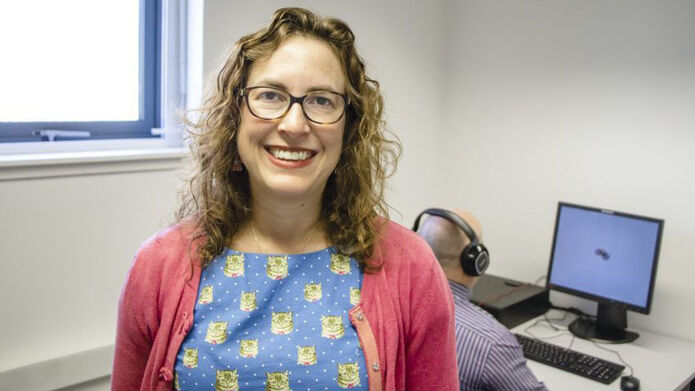 female academic near computer