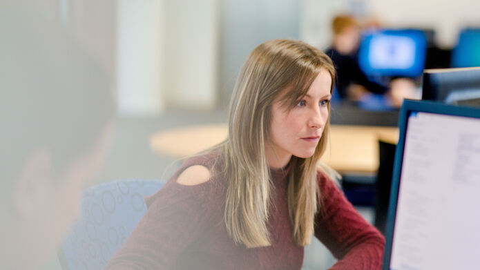 girl sitting working at computer