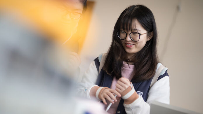 a student smiling in a class