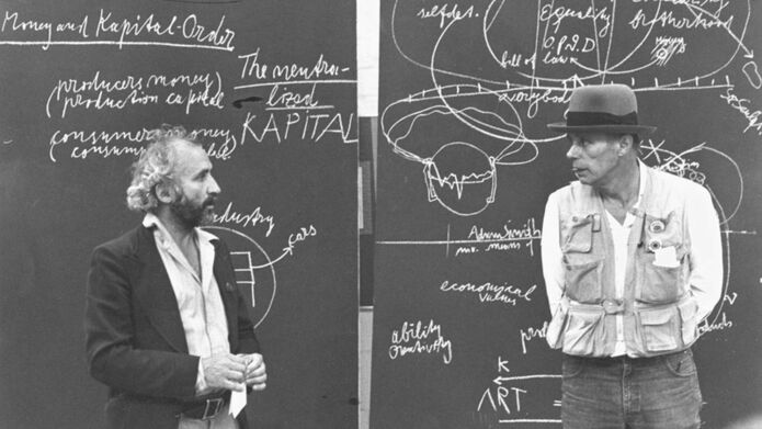 image of men standing in front of chalkboard