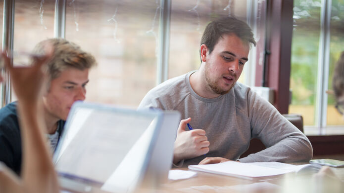 two students working at a table