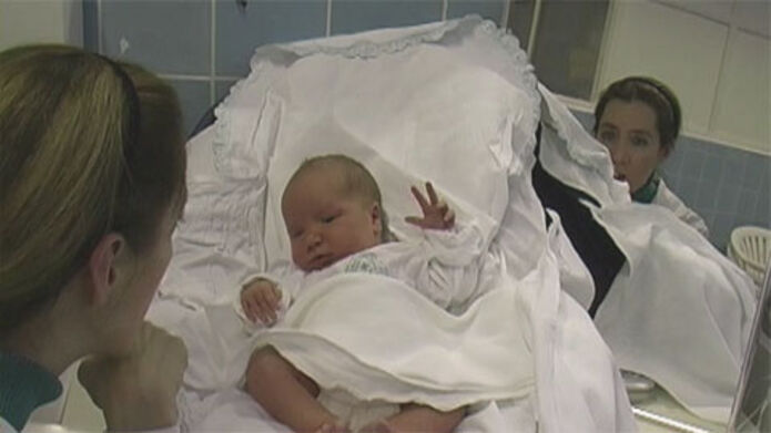 Photo showing research about how infants imitate people