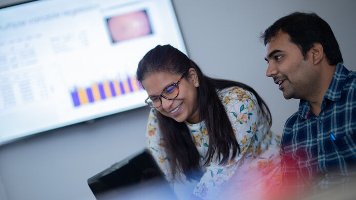 Postgraduate researchers working together