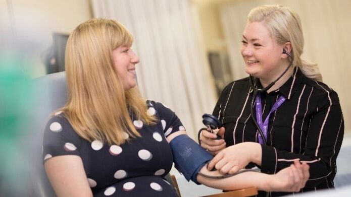A medical professional interacting with a patient