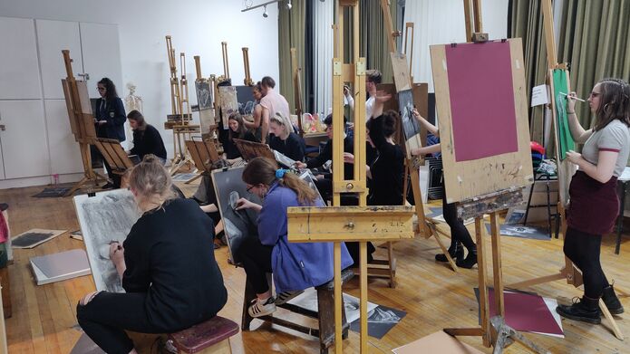 students working at easels