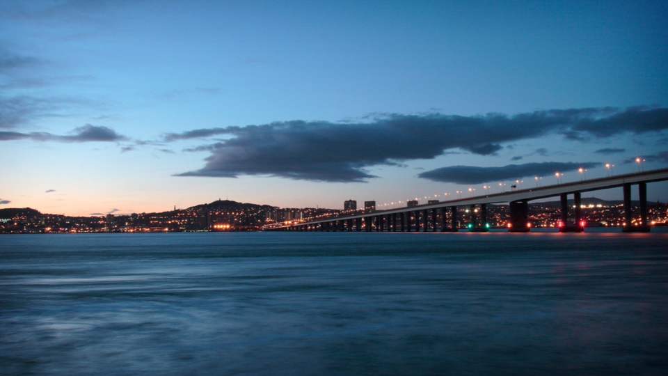 The Dundee skyline with the bridge, at night.