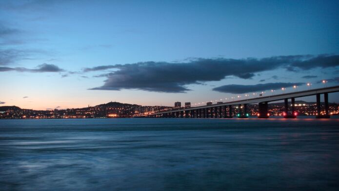 The Dundee skyline with the bridge, at night.