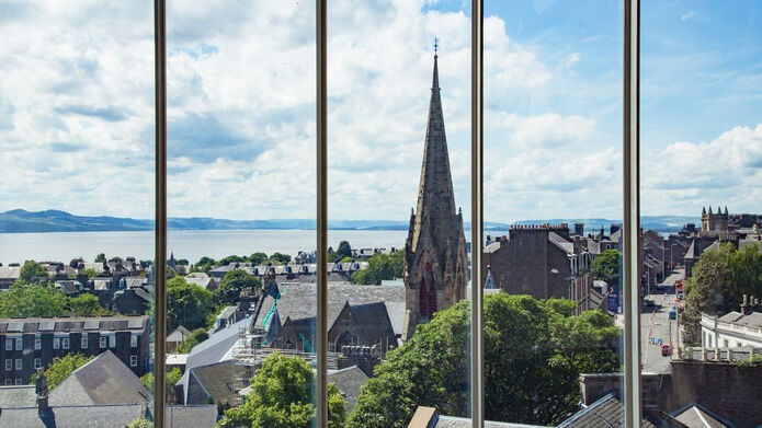 A view of the Dundee skyline out towards the Tay Estuary, as seen through a window at DJCAD