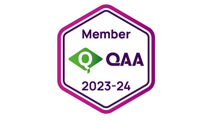 QAA membership logo 23-24. A hexagon shape in purple with the membership QAA writing on the inside.