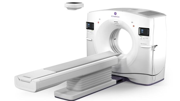 An MRI machine displayed against a plain white background, showcasing its cylindrical design and control panel