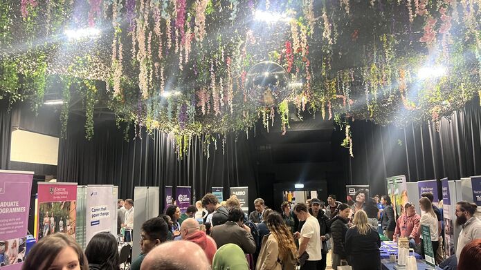 A busy room of attendees at the employability careers fair