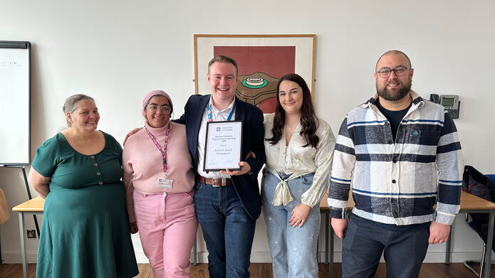 Scottish Youth Parliament volunteers holding a certificate of 2024 Student Volunteering Organisation of the Year 2024