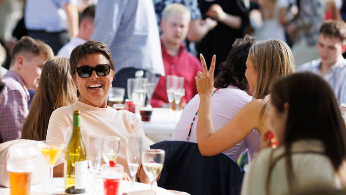 people smiling and having fun at graduation garden party