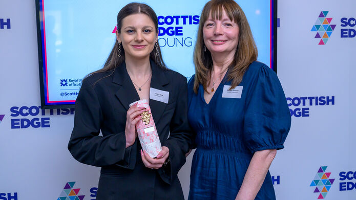 Justyna Skop stands alongside Marjory Sweeney of Scottish Enterprise with her award.jpg