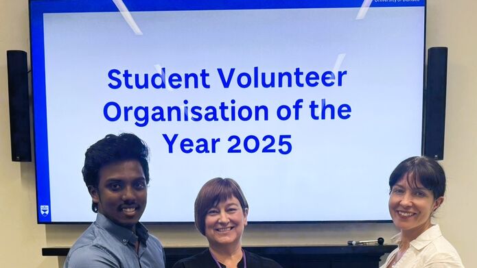 The volunteer awards 2025 certificate is handed to Volunteering Programme Manager Lesley Toles SPCA staff member