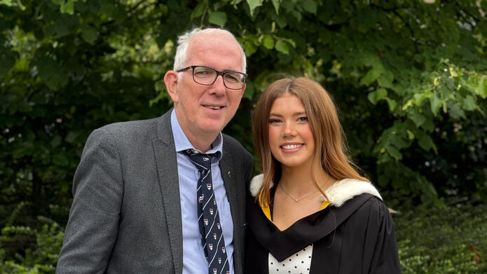 Maria Boyle and her father at graduation