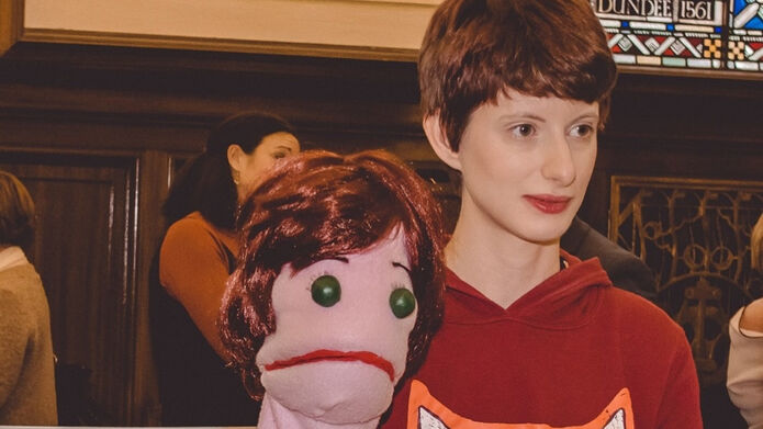 Graduate Deborah Chapman holding a puppet