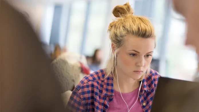 Student studying in an IT suite