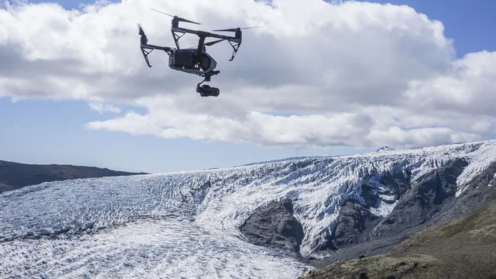 Photograph of a drone in flight above Skálafellsjökull glacier